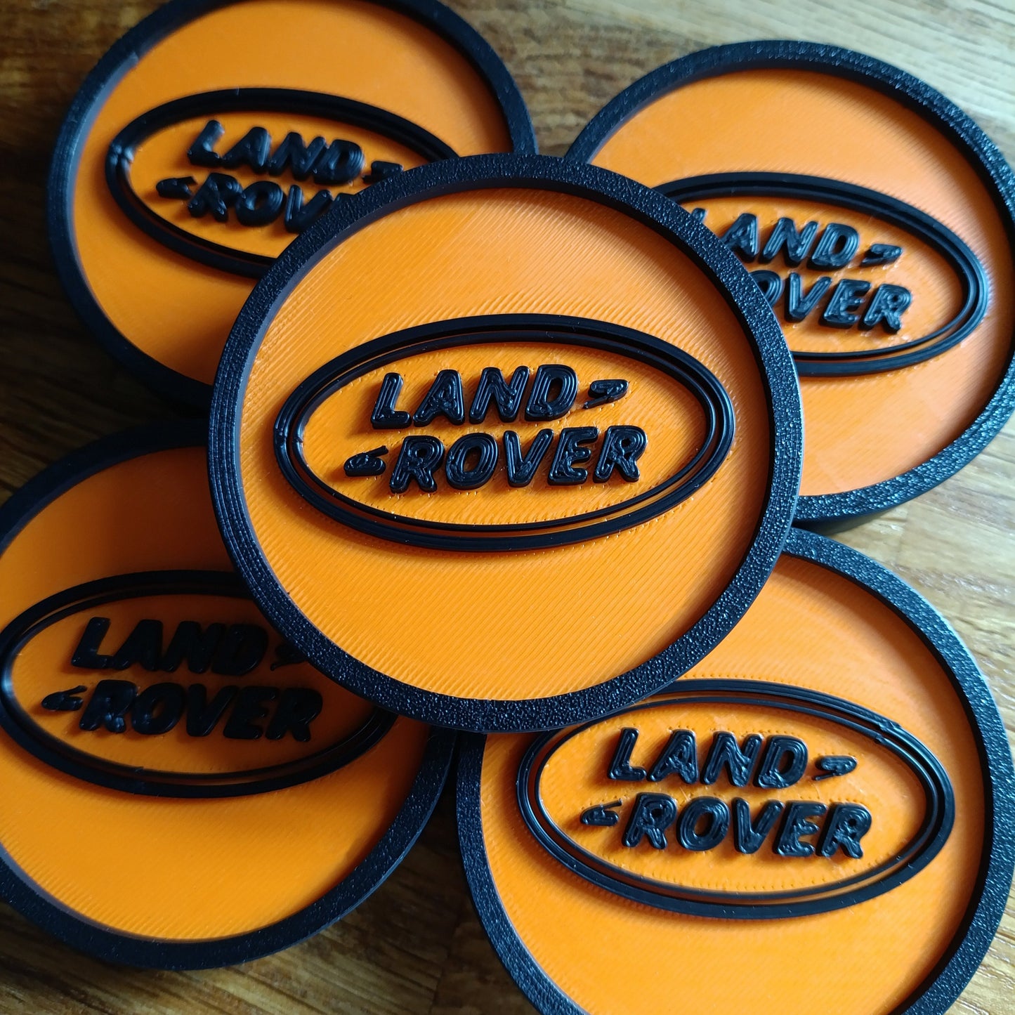 Land Rover Discovery 2 Centre Caps - Black/Orange LR Logo
