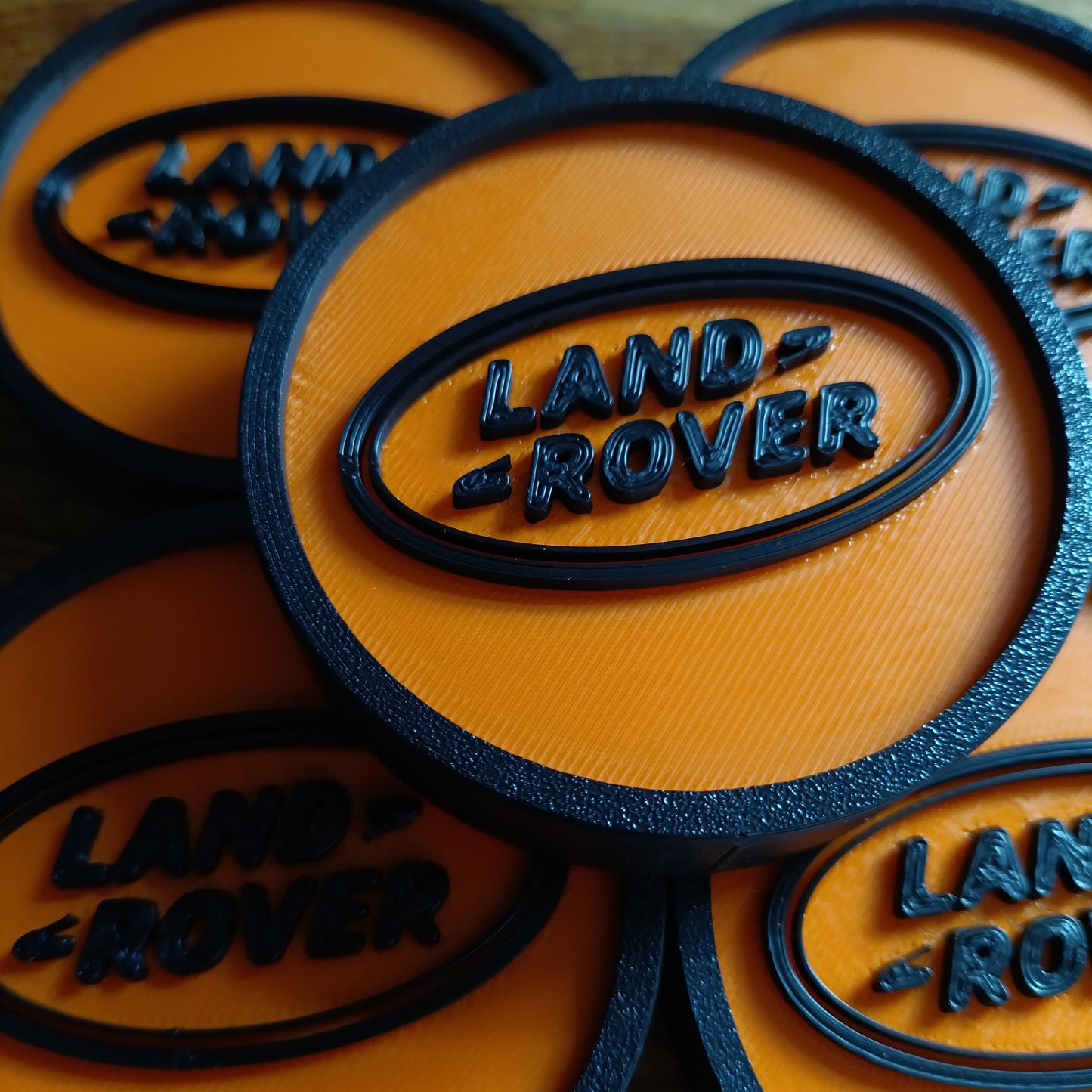 Land Rover Discovery 2 Centre Caps - Black/Orange LR Logo